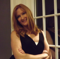 Elizabeth Bourgeret, red hair, black vest Picture